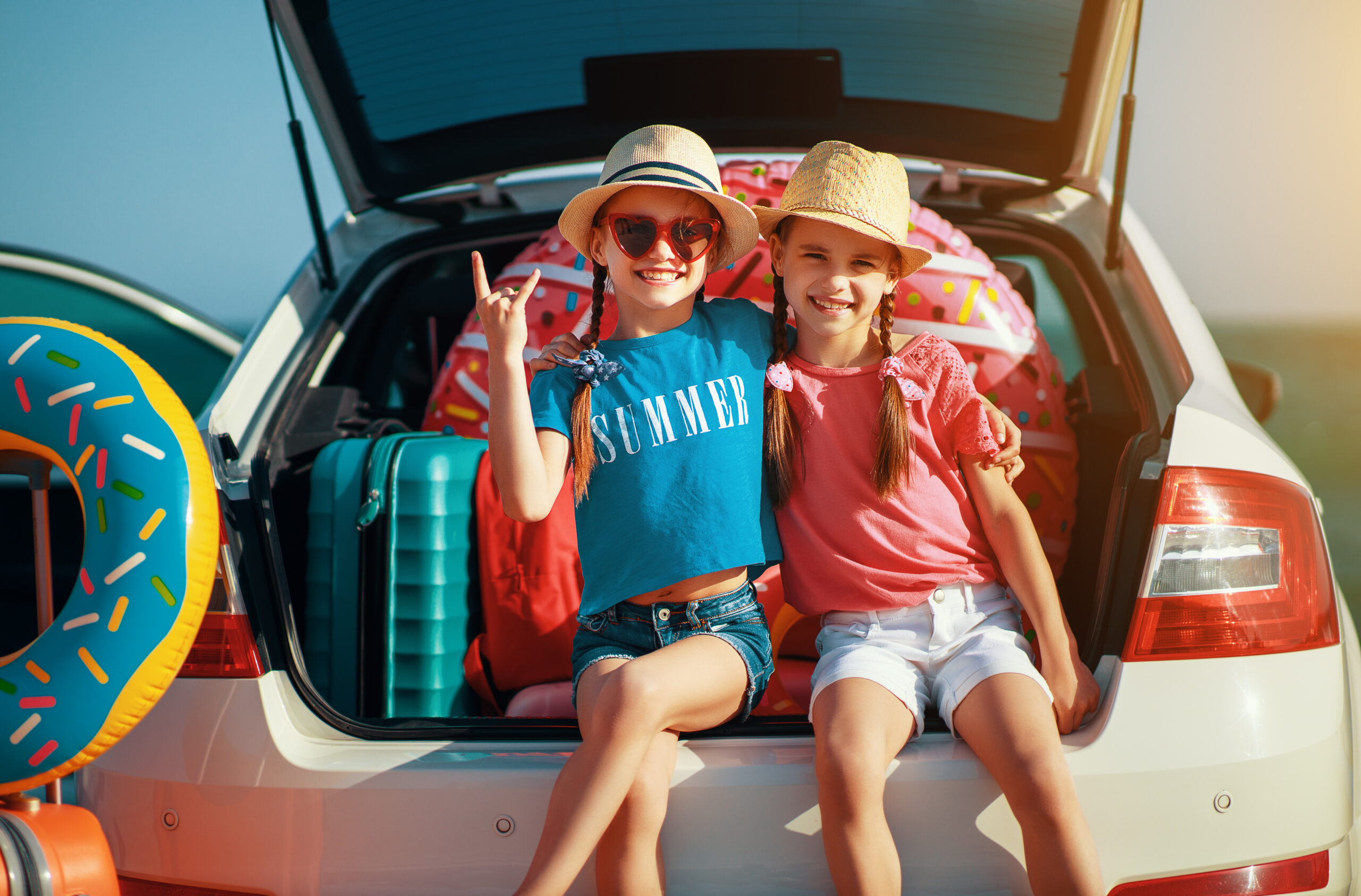 happy children on car trip tickets