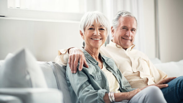 senior couple at home thinking about next bus trip