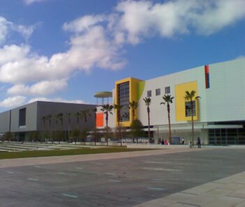 Tampa musuem of art building with a cloudy sky. Things to do in Tampa with RedCoach USA.