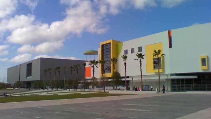 Tampa musuem of art building with a cloudy sky. Things to do in Tampa with RedCoach USA.